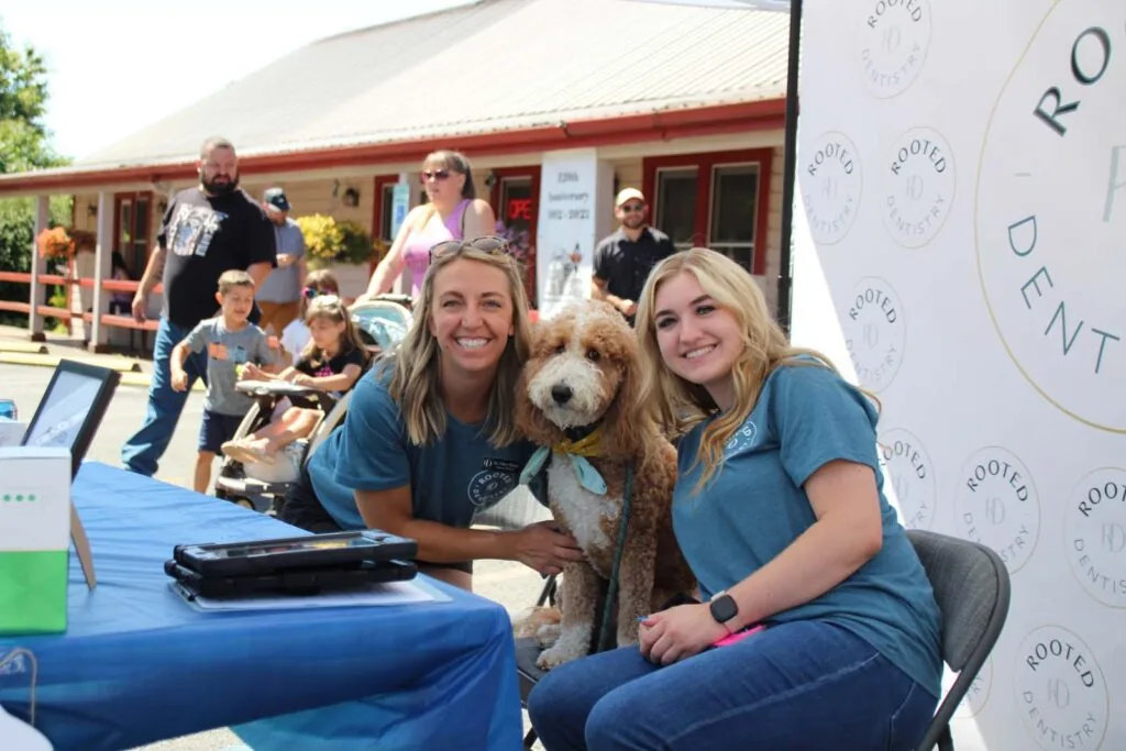 Doctor mirick posing and smiling with a dental team member